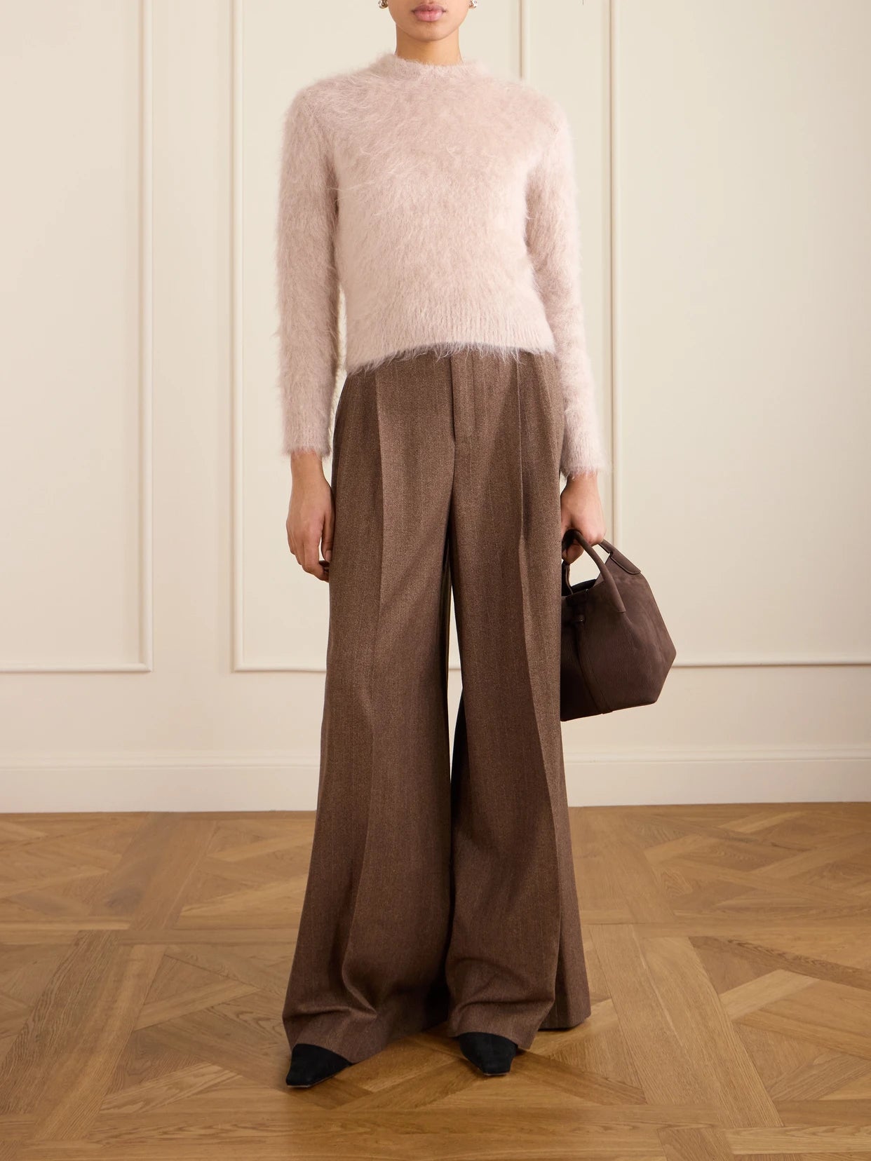Image of a model wearing Pants. Product name - Pleated Pinstriped Wool And Cashmere-blend Wide-leg Pants in Brown colour by brand - Loro Piana