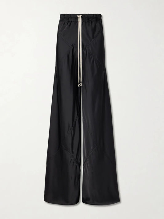Image of a model wearing Pants. Product name - Charmeuse Wide-leg Drawstring Pants in Black colour by brand - Rick Owens