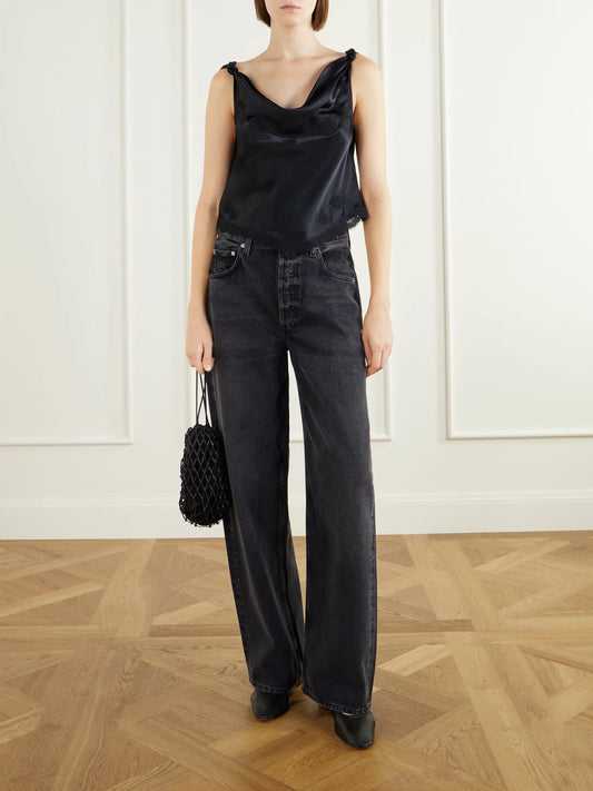 Image of a model wearing Tops. Product name - Manon Gathered Lace-trimmed Silk-satin Top in Black, Cream colour by brand - DÔEN
