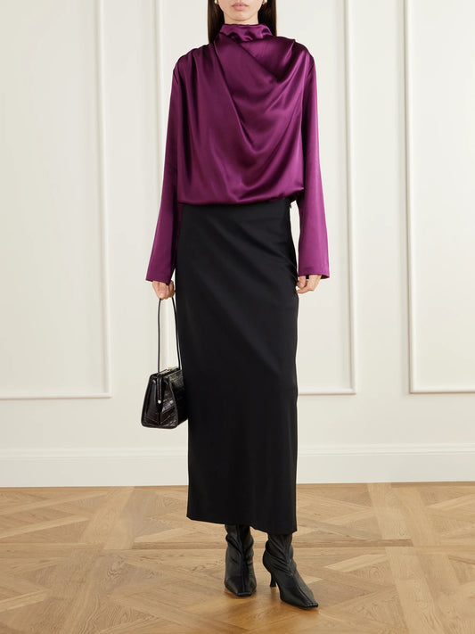 Image of a model wearing Tops. Product name - Sybil Draped Silk-satin Blouse in Dark purple colour by brand - Heirlome