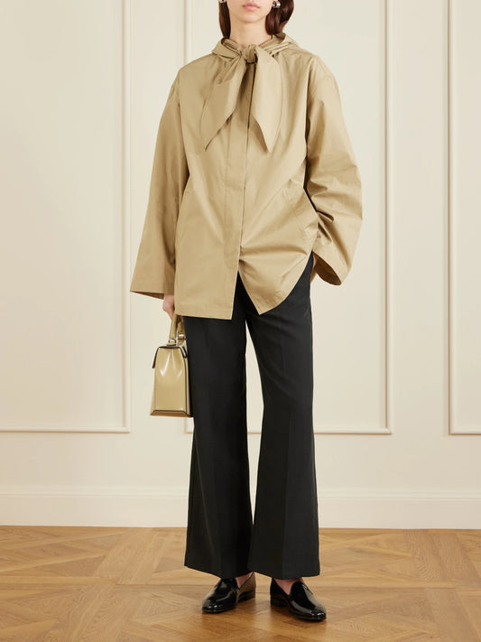 Image of a model wearing Pants. Product name - Linen Wide-leg Pants in Black colour by brand - TOTEME