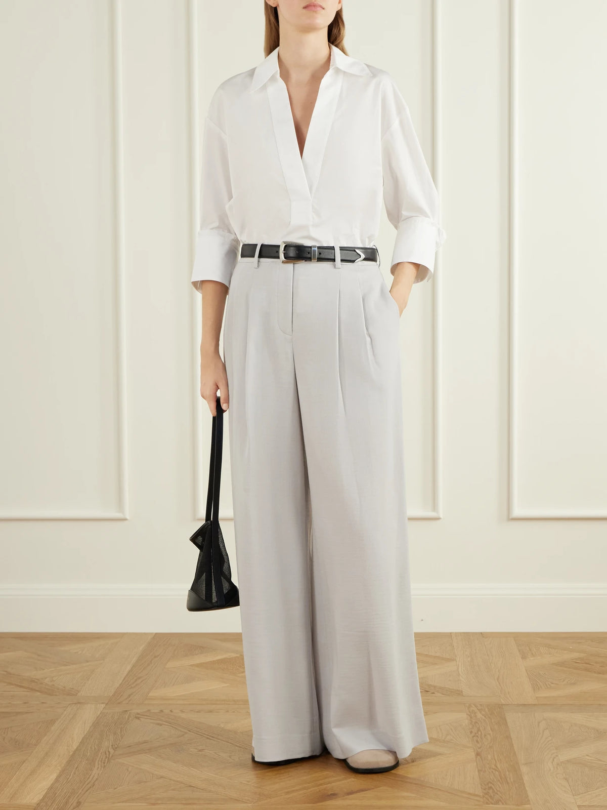 Image of a model wearing Pants. Product name - Avery Stretch Wool-crepe Wide-leg Pants in Gray colour by brand - TWP