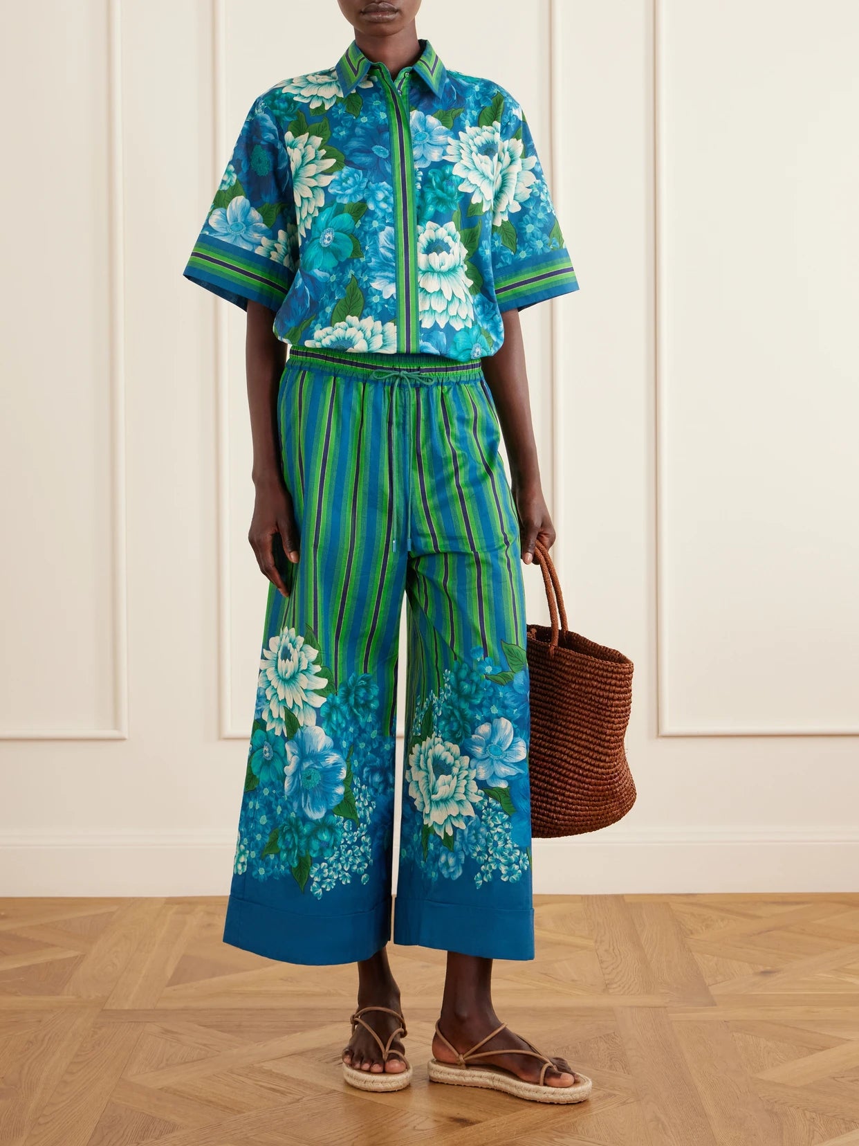 Image of a model wearing Tops. Product name - Margo Striped Floral-print Organic Cotton-voile Shirt in Multi colour by brand - ALÉMAIS