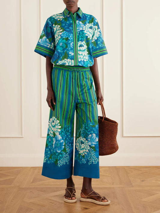 Image of a model wearing Tops. Product name - Margo Striped Floral-print Organic Cotton-voile Shirt in Multi colour by brand - ALÉMAIS