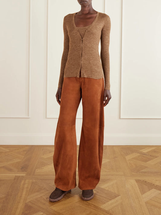 Image of a model wearing Pants. Product name - Amoret Suede Wide-leg Pants in Brown colour by brand - Gabriela Hearst