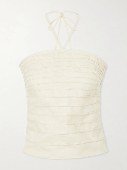 Image of a model wearing Tops. Product name - En Tu Luz Embroidered Linen Bustier Top in Ivory colour by brand - Andres Otalora
