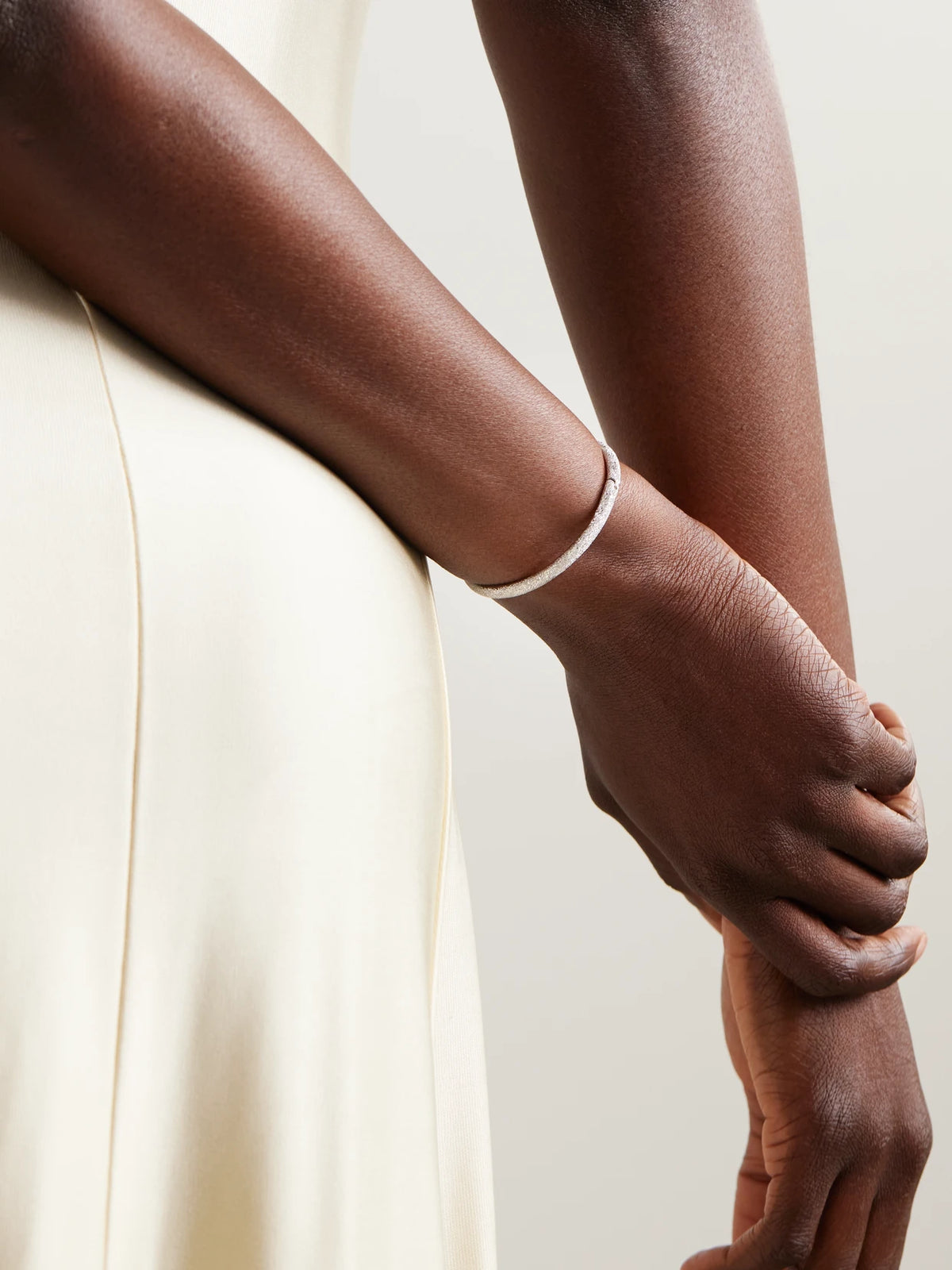 Image of Bracelets. Product name - Florentine Finish 18-karat White Gold Bangle in Multi colour by brand - Carolina Bucci