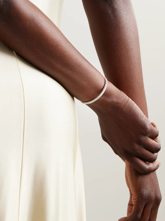 Image of Bracelets. Product name - Florentine Finish 18-karat White Gold Bangle in Multi colour by brand - Carolina Bucci