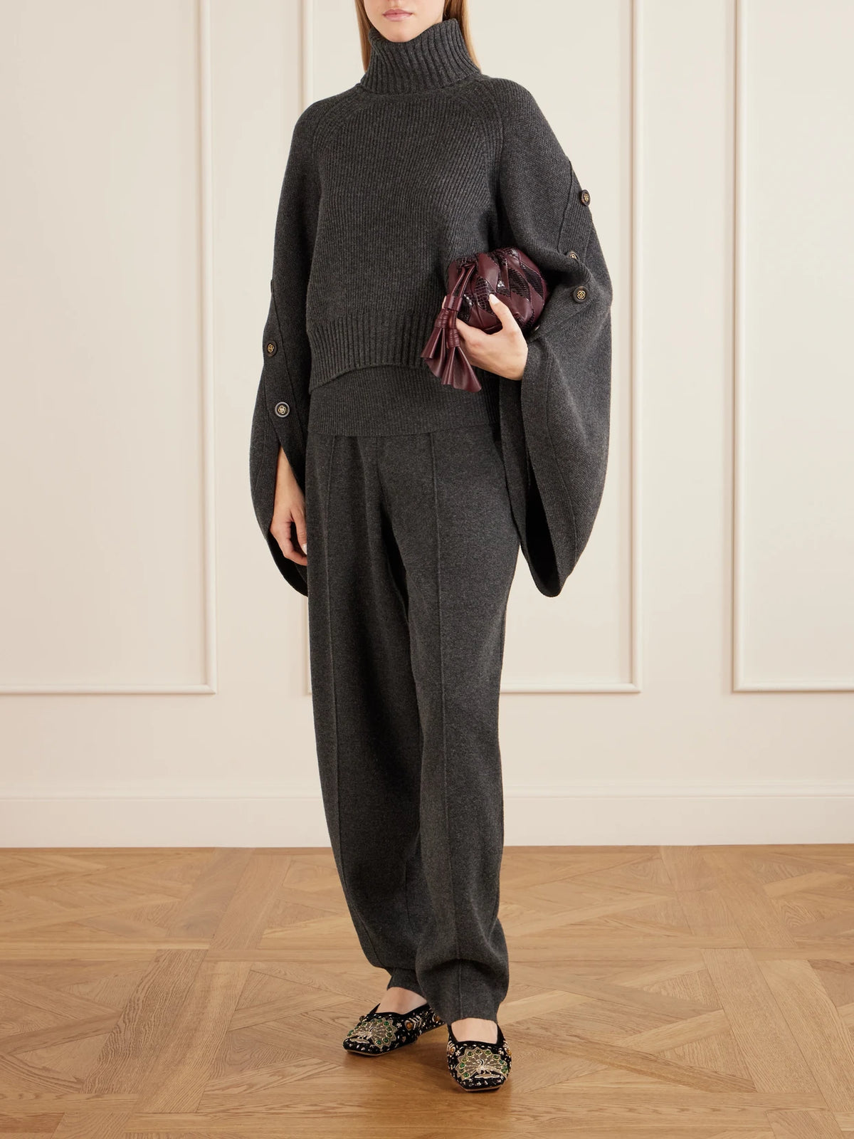 Image of a model wearing Outerwear. Product name - Valiant Merino Wool Turtleneck Sweater in Gray colour by brand - Zimmermann