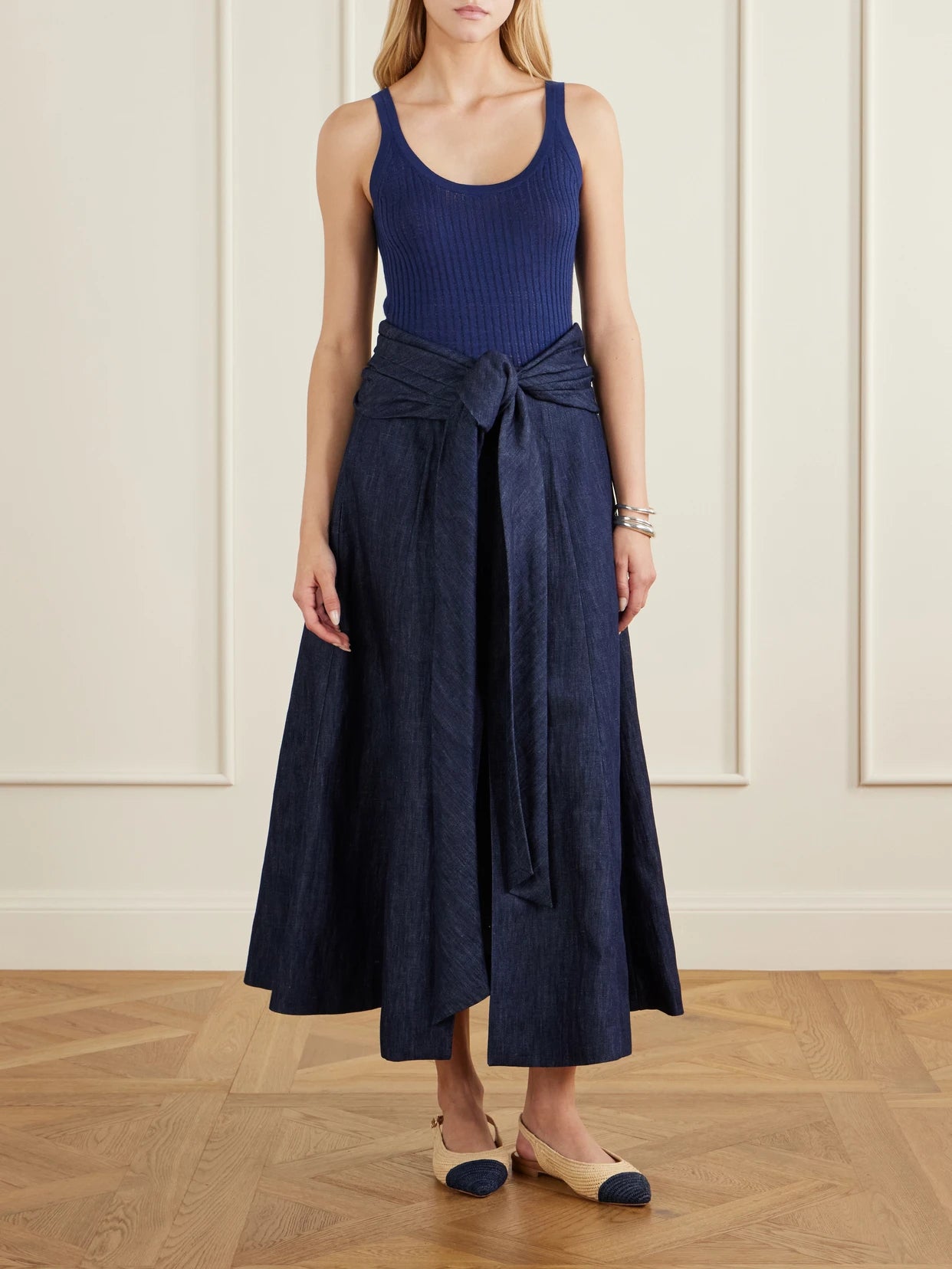 Image of a model wearing Skirts. Product name - Zivan Cotton And Linen-blend Maxi Skirt in Dark denim colour by brand - Gabriela Hearst