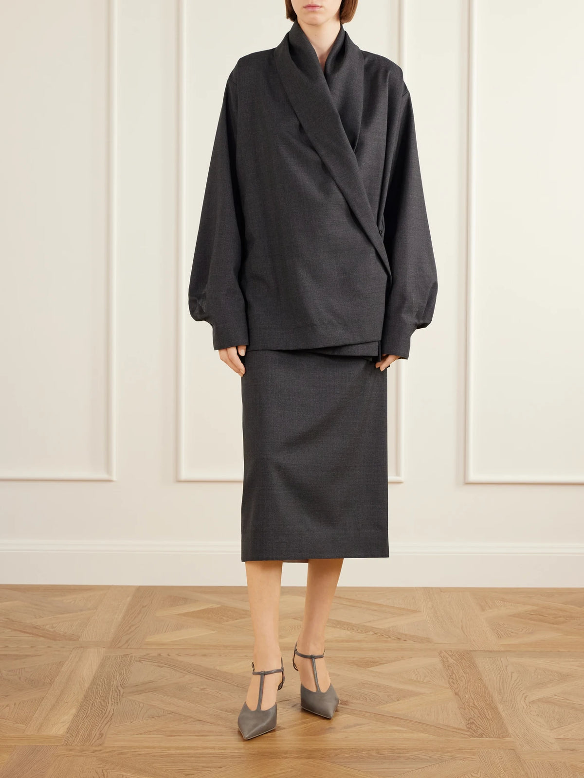 Image of a model wearing Skirts. Product name - Eulalia Wool-woven Midi Skirt in Dark gray colour by brand - Calvin Klein Collection