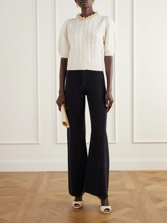Image of a model wearing Outerwear. Product name - Olivia Cable-knit Bead-embellished Wool And Cashmere-blend Cardigan in Ivory colour by brand - Ulla Johnson