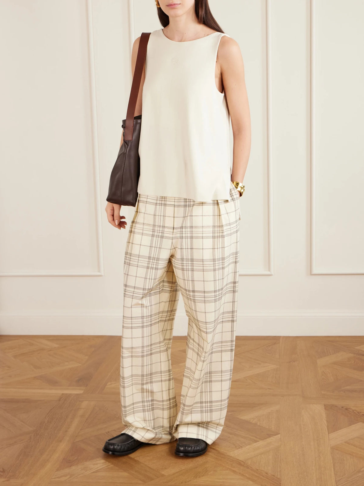 Image of a model wearing Tops. Product name - Anagram Embroidered Ribbed-knit Tank Top in Cream colour by brand - LOEWE