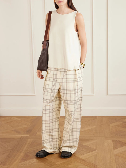 Image of a model wearing Tops. Product name - Anagram Embroidered Ribbed-knit Tank Top in Cream colour by brand - LOEWE