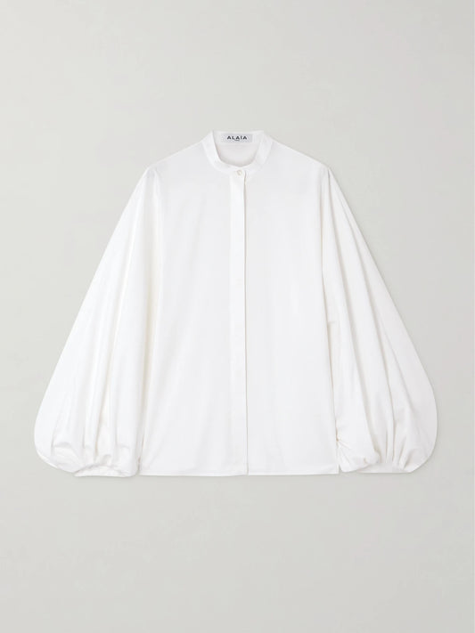 Image of a model wearing Tops. Product name - Cotton-poplin Blouse in White colour by brand - Alaïa