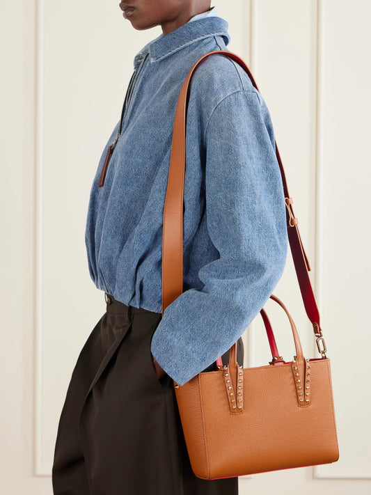 Image of Bags. Product name - Cabata Mini Spiked Textured-leather Tote in Tan colour by brand - Christian Louboutin