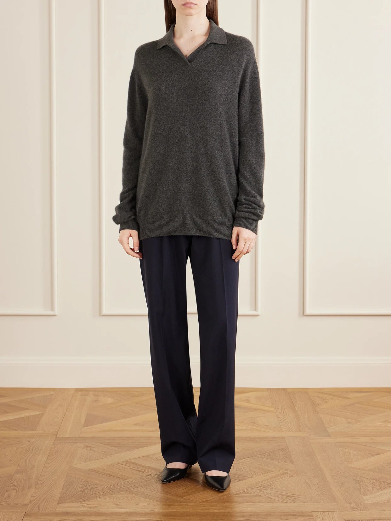 Image of a model wearing Outerwear. Product name - Oashi Cashmere Knit in Anthracite colour by brand - The Row