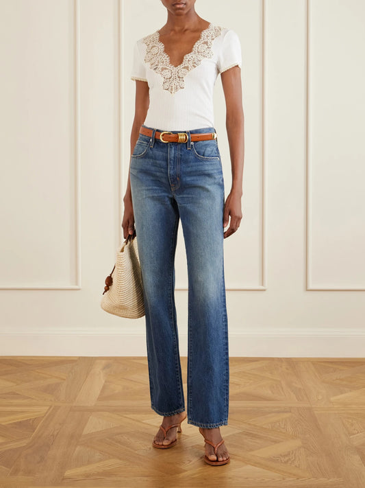 Image of a model wearing Tops. Product name - Nalia Lace-trimmed Organic Cotton T-shirt in White colour by brand - DÔEN