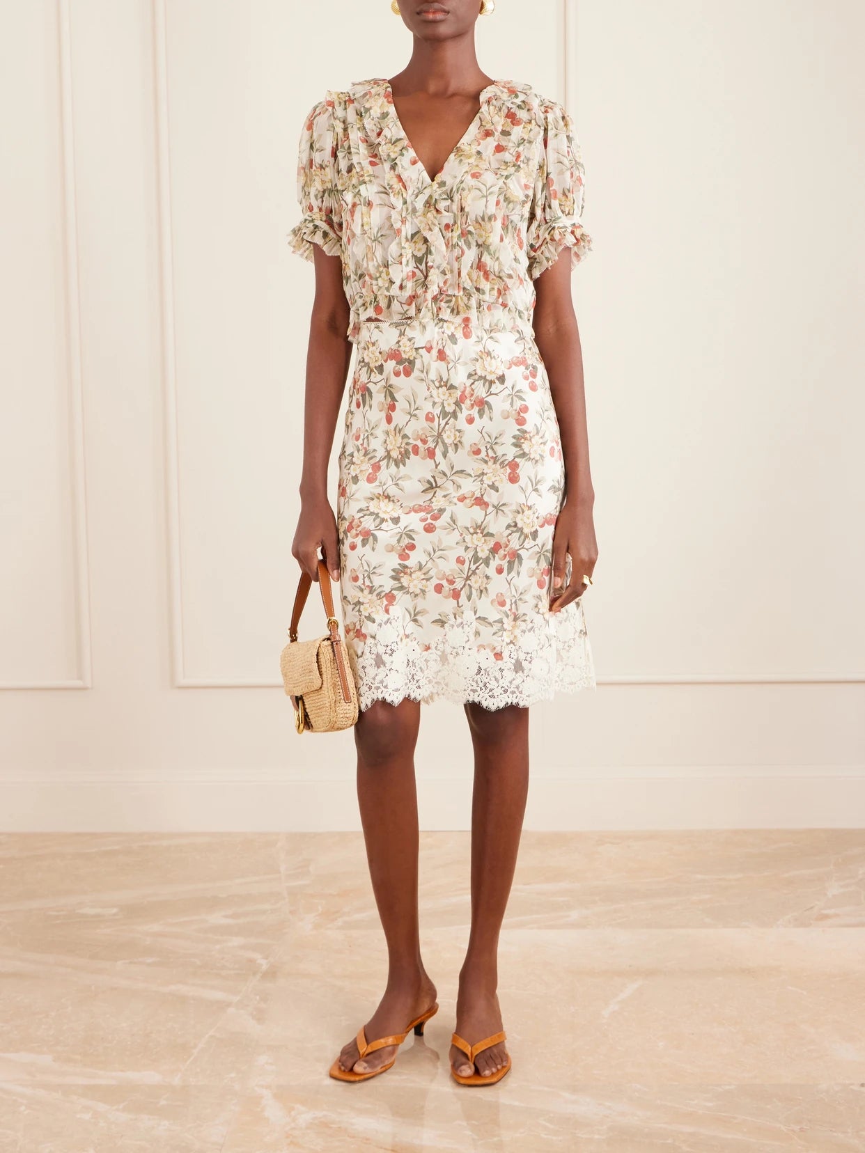 Image of a model wearing Skirts. Product name - Elowette Lace-trimmed Floral-print Silk-satin Midi Skirt in Multi colour by brand - DÔEN