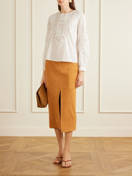 Image of a model wearing Tops. Product name - Marlowe Broderie Anglaise Cotton Blouse in White colour by brand - Ulla Johnson