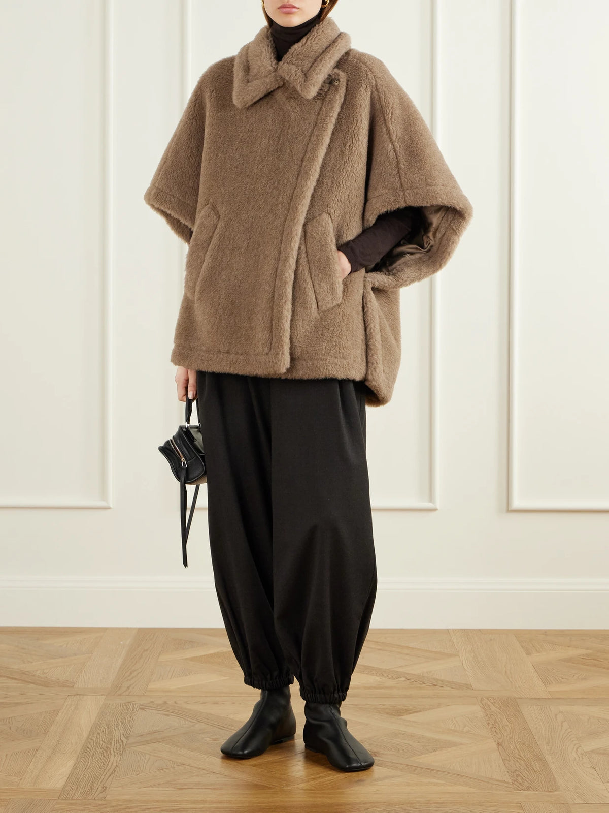 Image of a model wearing Pants. Product name - Pergola Wool-blend Tapered Pants in Dark brown colour by brand - Max Mara