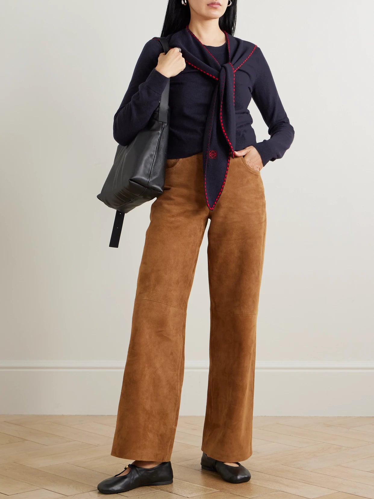 Image of a model wearing Outerwear. Product name - Tie-detail Embroidered Knitted Top in Navy colour by brand - LOEWE