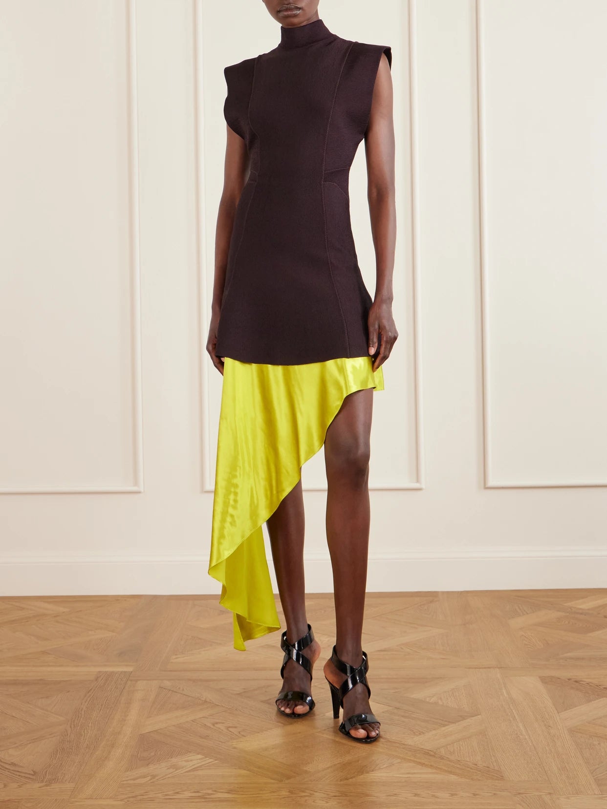 Image of a model wearing Skirts. Product name - Asymmetric Satin Midi Skirt in Lime green colour by brand - Alaïa