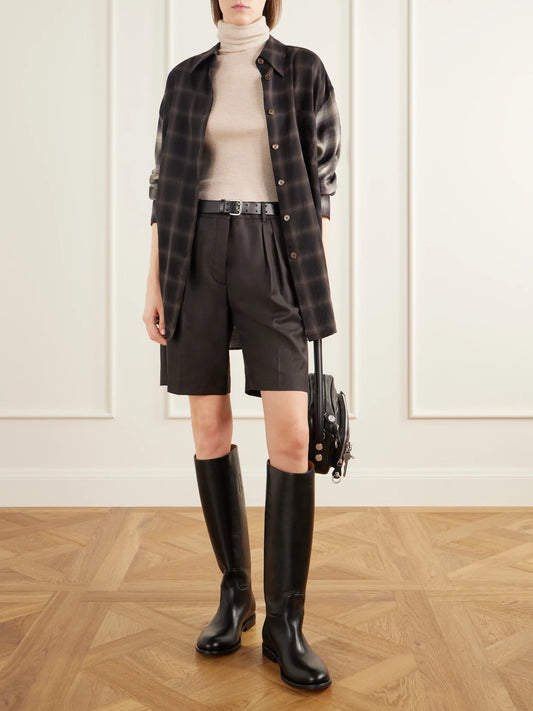 Image of a model wearing Shorts. Product name - Rockan Pleated Wool-twill Shorts in Dark gray colour by brand - Acne Studios