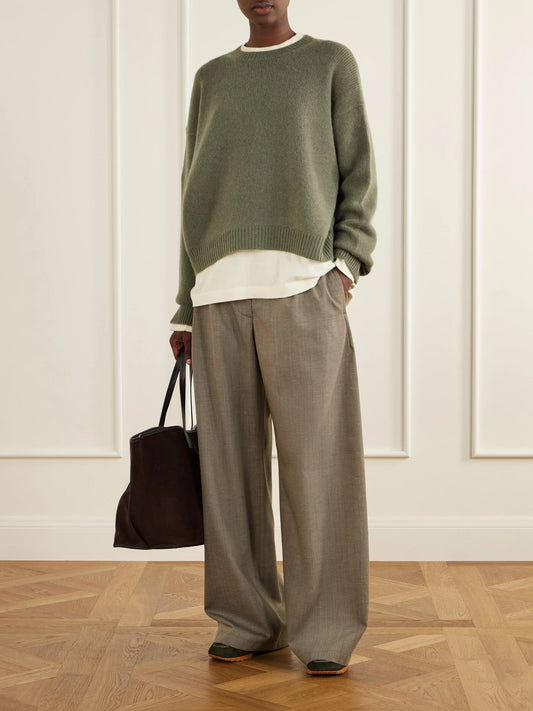 Image of a model wearing Outerwear. Product name - The Ivy Cashmere Sweater in Army green colour by brand - Arch4
