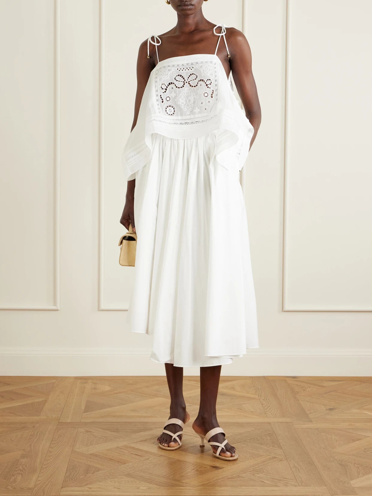 Image of a model wearing Tops. Product name - Embroidered Ramie Top in White colour by brand - Self-Portrait