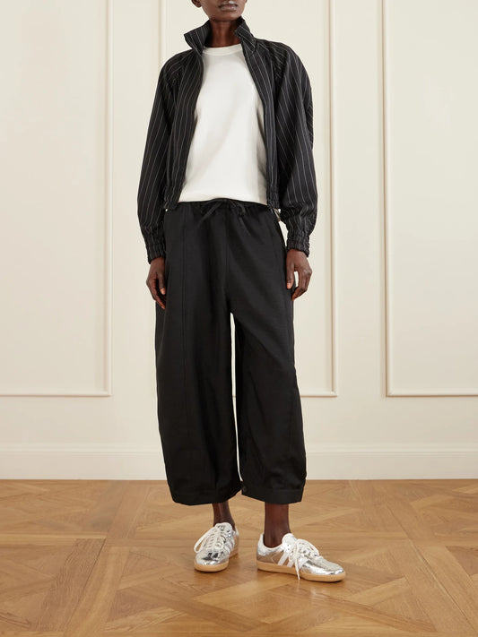 Image of a model wearing Tops. Product name - + Y-3 Cropped Recycled-jersey Wide-leg Pants in Black colour by brand - adidas Originals