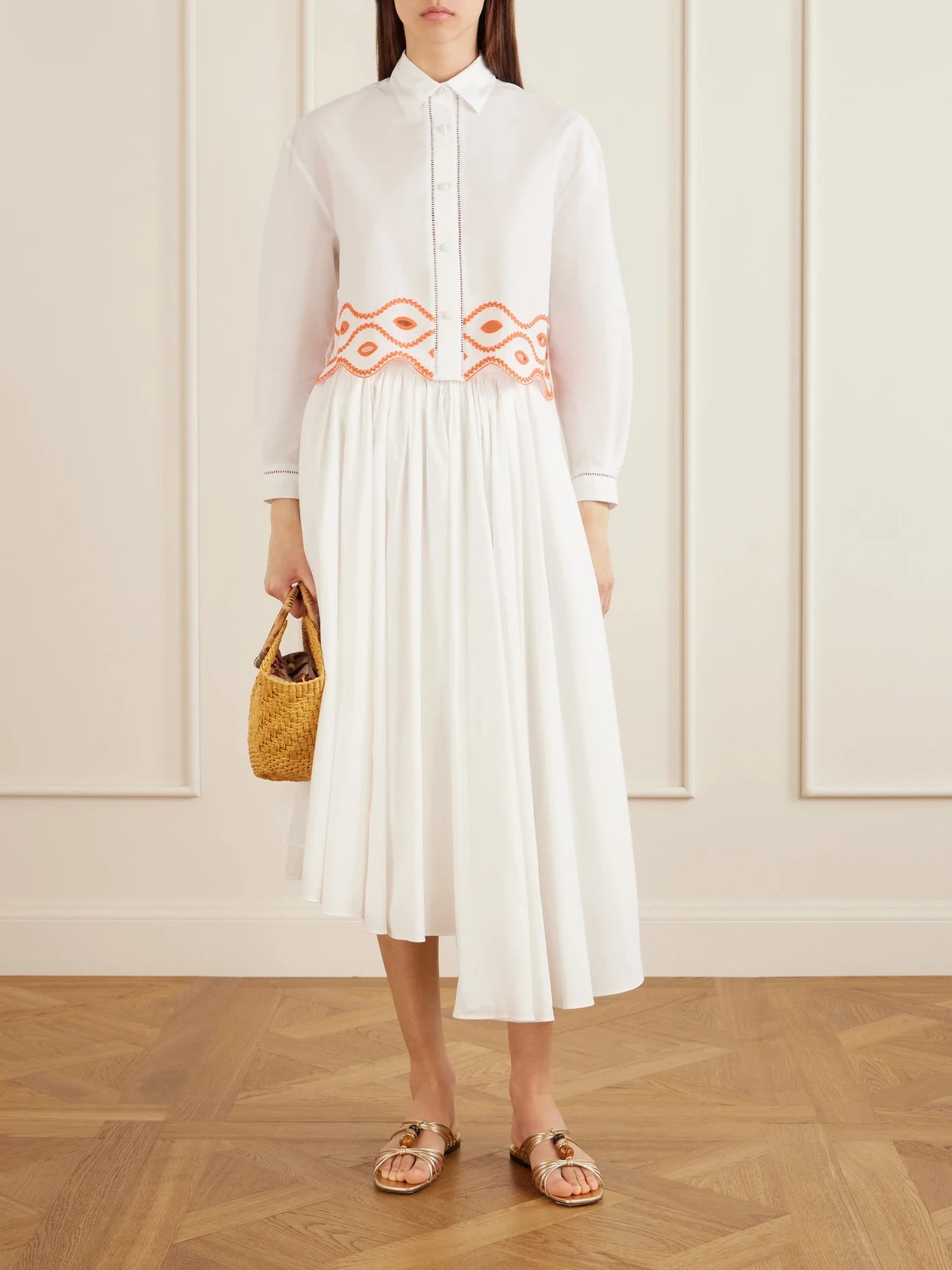 Image of a model wearing Tops. Product name - Assia Cropped Broderie Anglaise-trimmed Cotton-voile Shirt in White colour by brand - Loretta Caponi