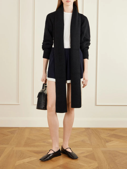 Image of a model wearing Outerwear. Product name - Suki Shrug Ribbed-knit Wool And Cashmere-blend Cardigan in Black colour by brand - KALLMEYER
