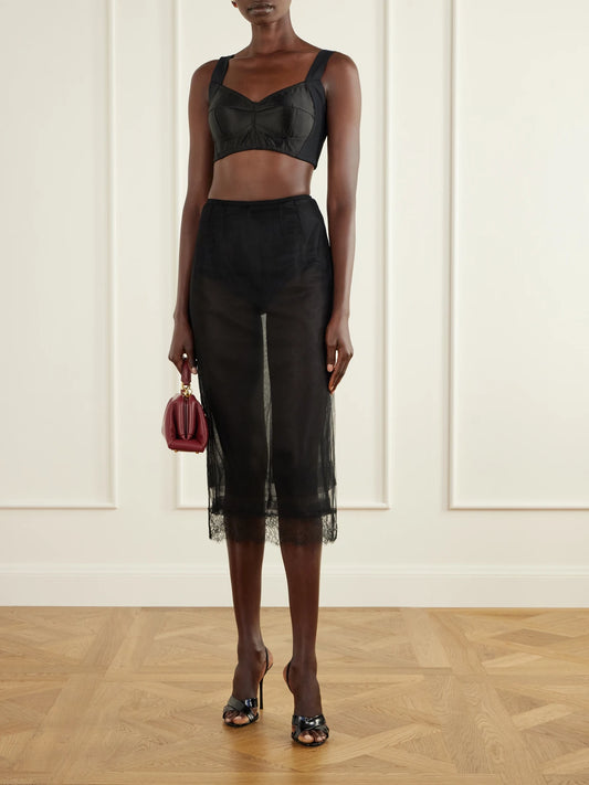 Image of a model wearing Skirts. Product name - Layered Lace-trimmed Tulle Midi Skirt in Black colour by brand - Dolce & Gabbana