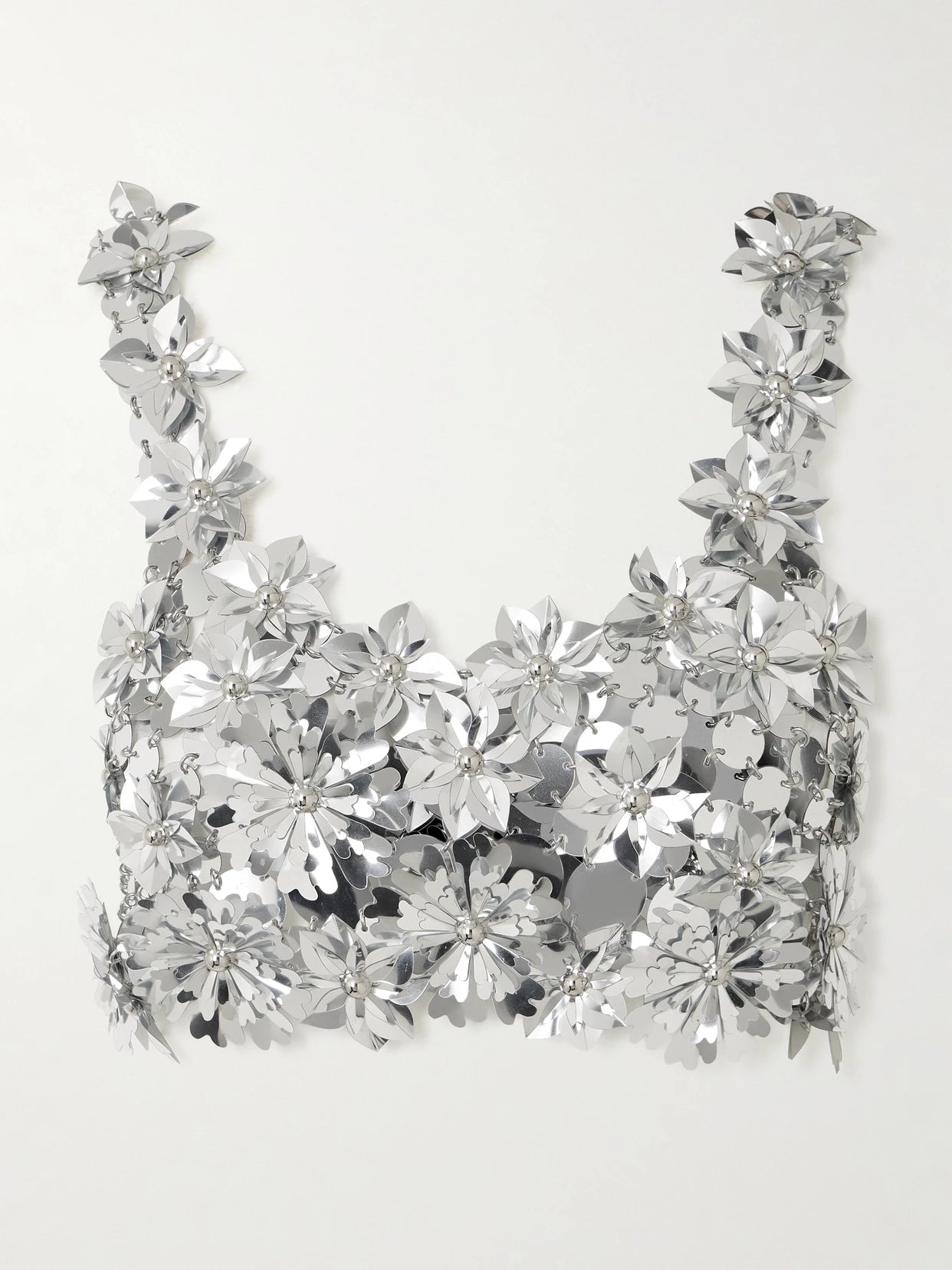 Image of a model wearing Tops. Product name - Cropped Embellished Chainmail Top in Silver colour by brand - RABANNE