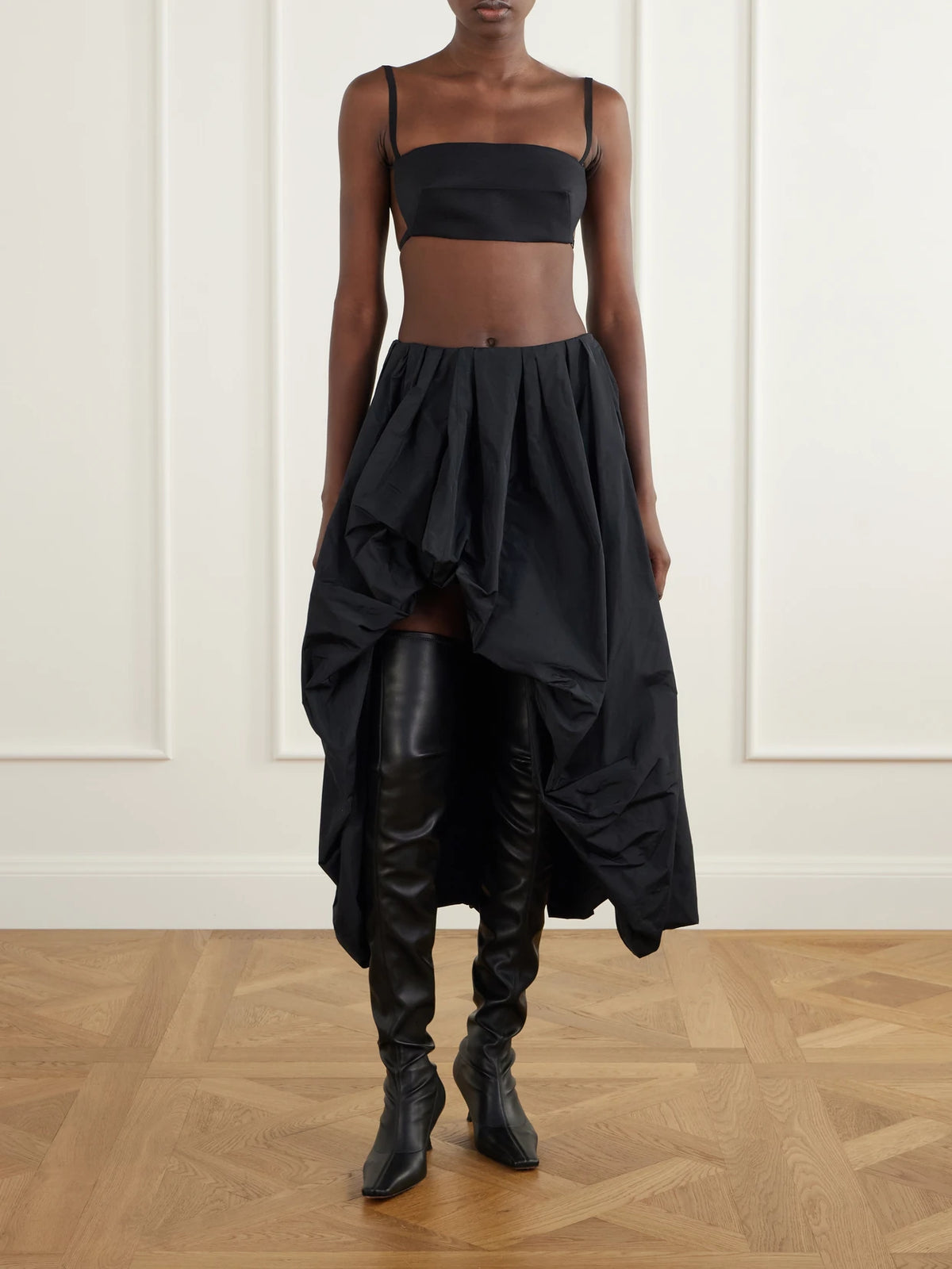 Image of a model wearing Tops. Product name - Cropped Wool And Silk-blend Top in Black colour by brand - Jil Sander