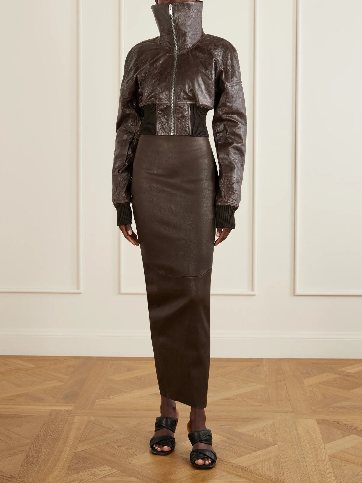 Image of a model wearing Skirts. Product name - Dirt Pillar Textured-leather Maxi Skirt in Brown colour by brand - Rick Owens
