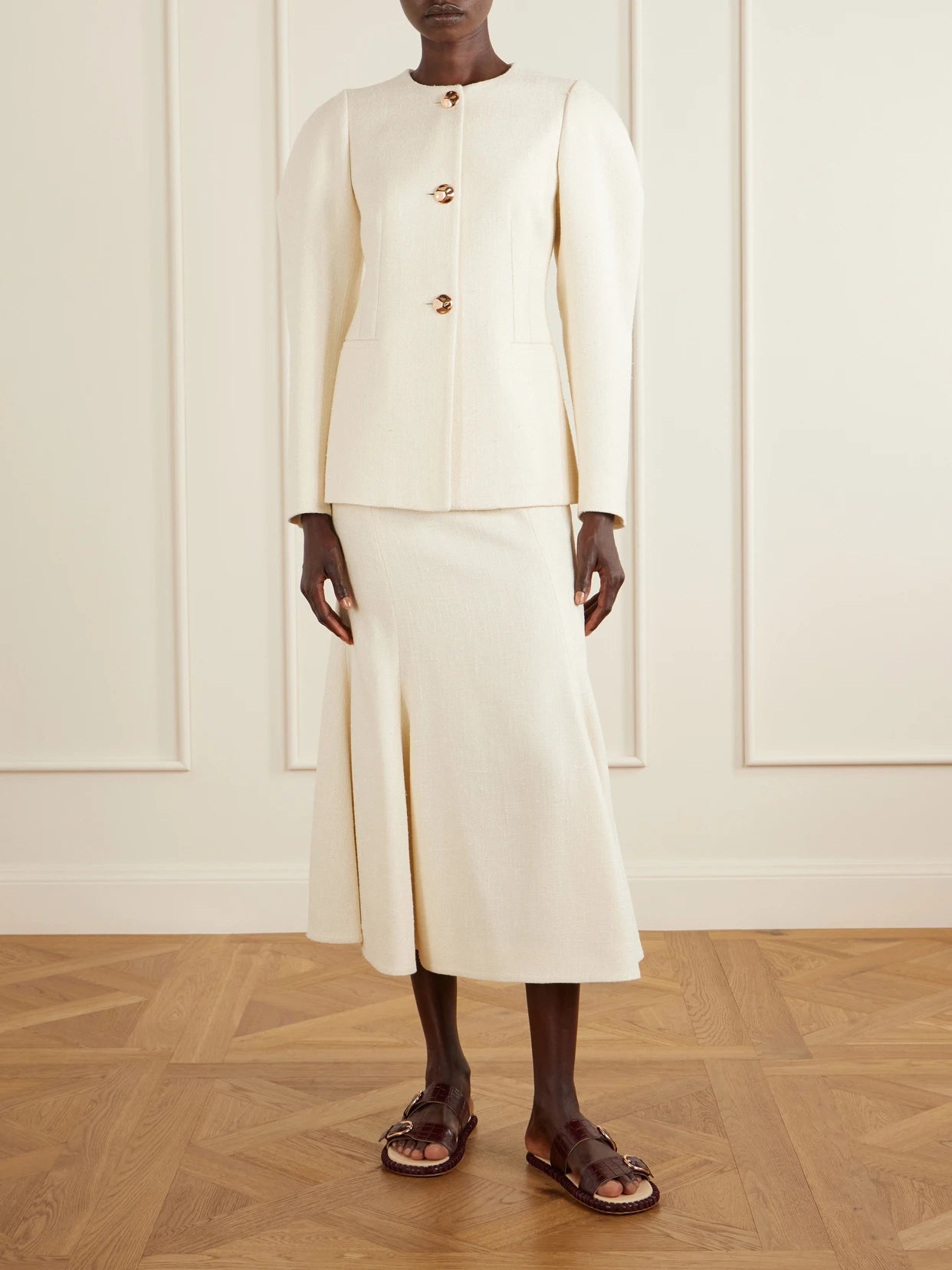 Image of a model wearing Skirts. Product name - Patterson Frayed Wool And Cashmere-blend Midi Skirt in Ivory colour by brand - Gabriela Hearst