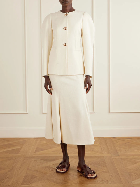 Image of a model wearing Skirts. Product name - Patterson Frayed Wool And Cashmere-blend Midi Skirt in Ivory colour by brand - Gabriela Hearst