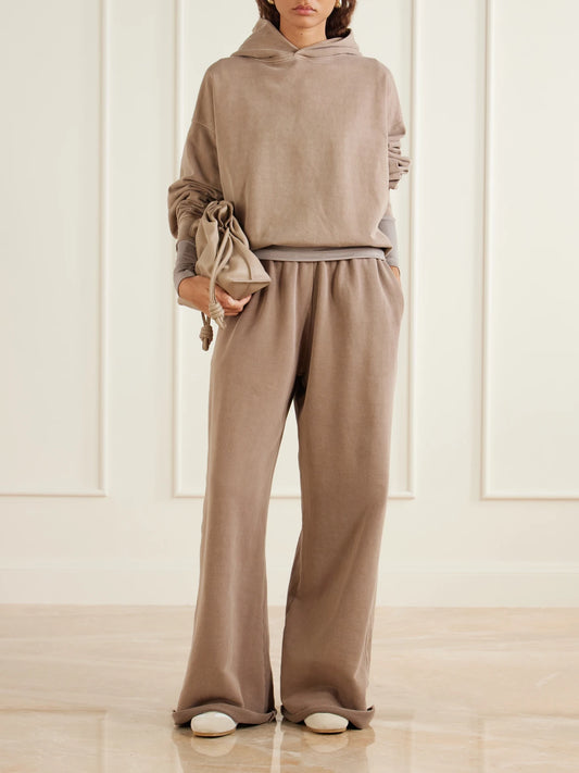Image of a model wearing Pants. Product name - Cotton-jersey Wide-legs Sweatpants in Taupe colour by brand - SLVRLAKE