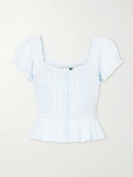 Image of a model wearing Tops. Product name - Sandi Cropped Broderie Anglaise Cotton Blouse in Blue colour by brand - RIXO