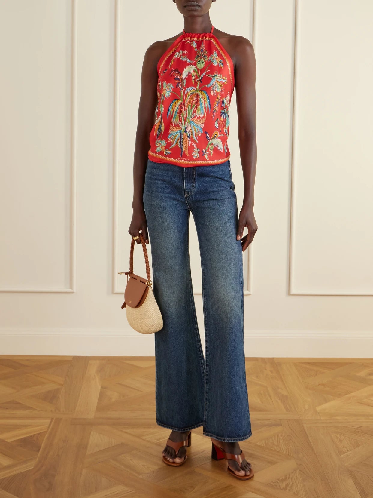 Image of a model wearing Tops. Product name - Printed Silk-satin Halterneck Top in Red colour by brand - Etro