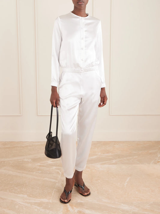 Image of a model wearing Pants. Product name - Rebecca Silk-satin Straight-leg Pants in White colour by brand - THE PARK