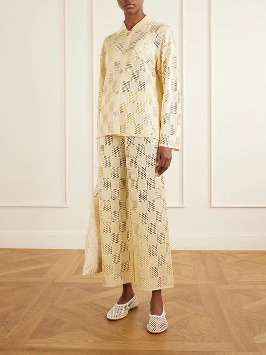 Image of a model wearing Pants. Product name - Checked Woven Wide-leg Pants in Pastel yellow colour by brand - Calle Del Mar