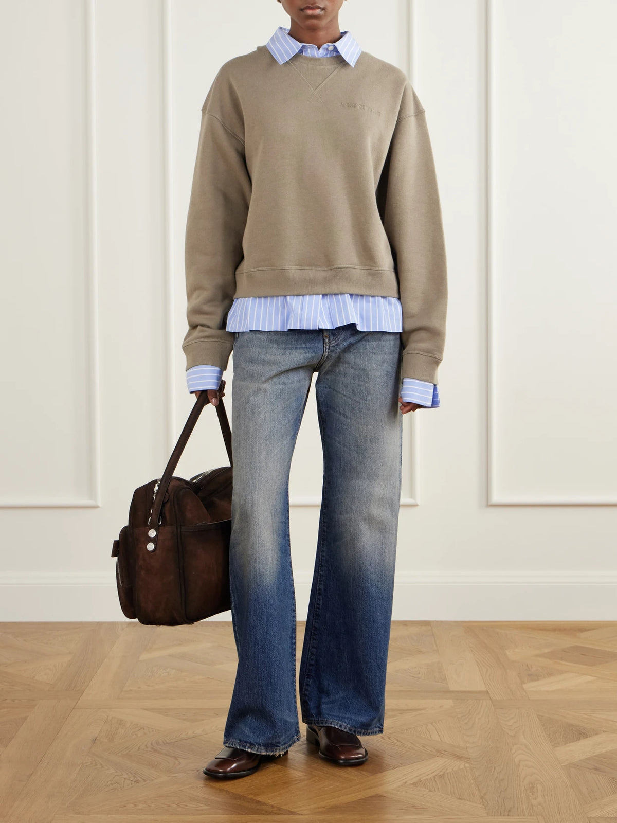 Image of a model wearing Tops. Product name - Layered Striped Poplin-trimmed Cotton-fleece Sweatshirt in Beige colour by brand - Acne Studios