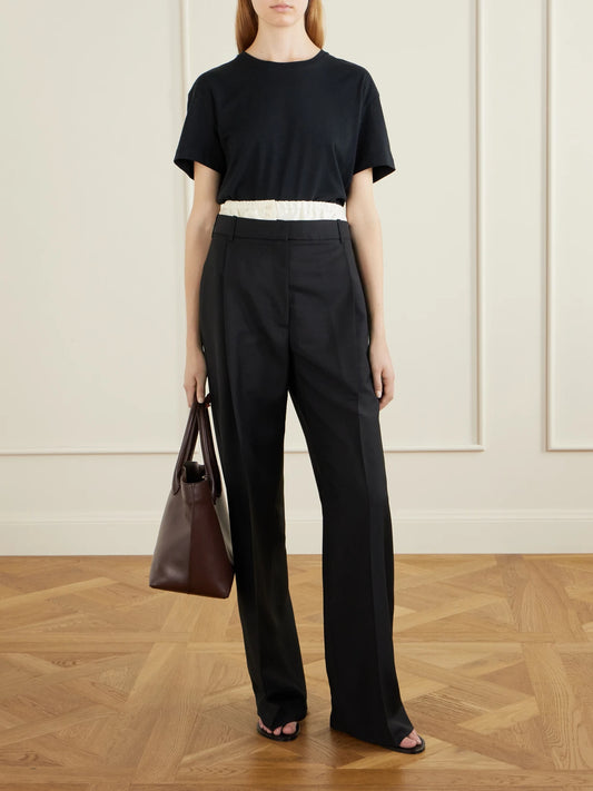 Image of a model wearing Pants. Product name - Wool And Mohair-blend Wide-leg Pants in Black colour by brand - RÓHE