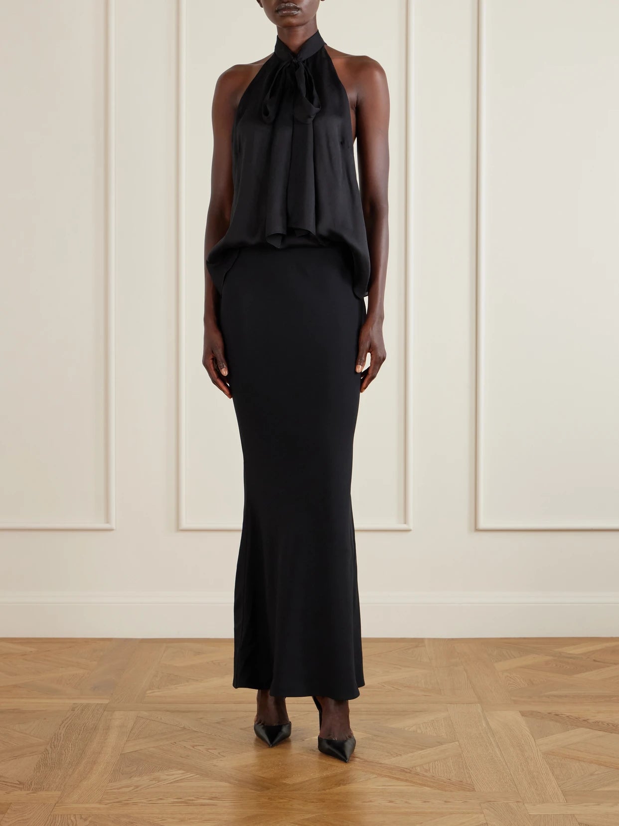 Image of a model wearing Tops. Product name - Monogram-printed Halterneck Silk-chiffon Tank in Black colour by brand - TOM FORD