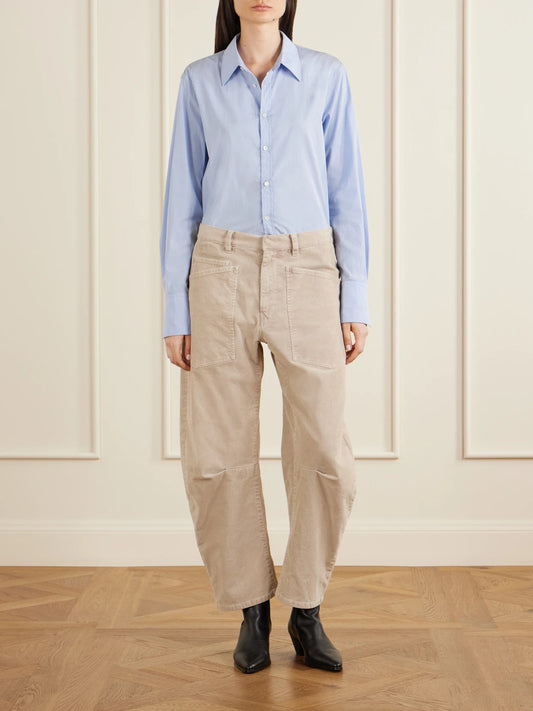 Image of a model wearing Tops. Product name - Ziggy Cotton-poplin Shirt in Light blue colour by brand - Nili Lotan
