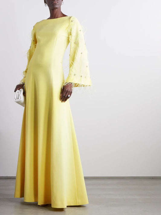Image of Dresses. Product name - Embellished Feathered Recycled Stretch-crepe Gown in Pastel yellow colour by brand - HUISHAN ZHANG