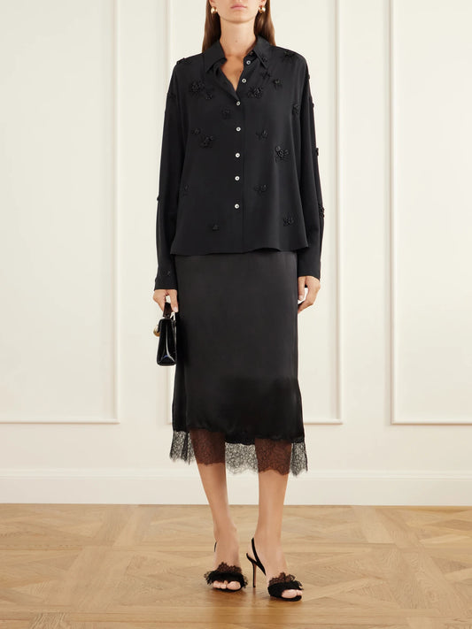 Image of a model wearing Tops. Product name - Everett Floral-embellished Silk Shirt in Black colour by brand - BERNADETTE